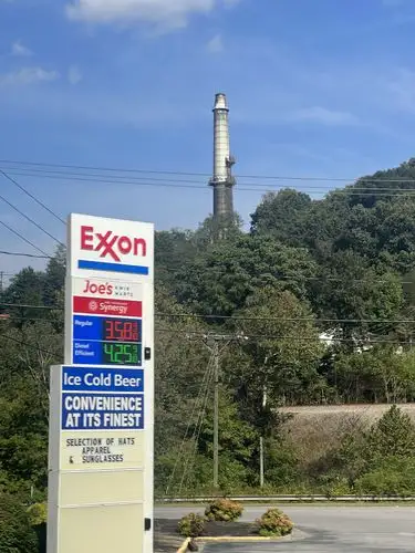 Roadside convenience meets towering industrial views.